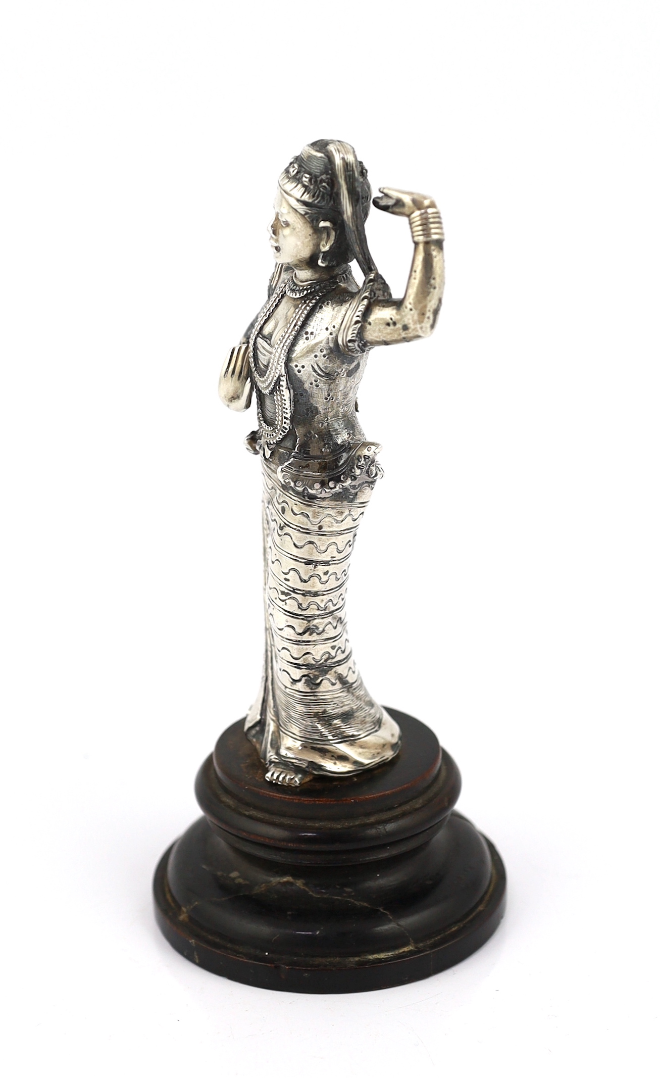 A Burmese cast silver model of a dancer, late 19th century